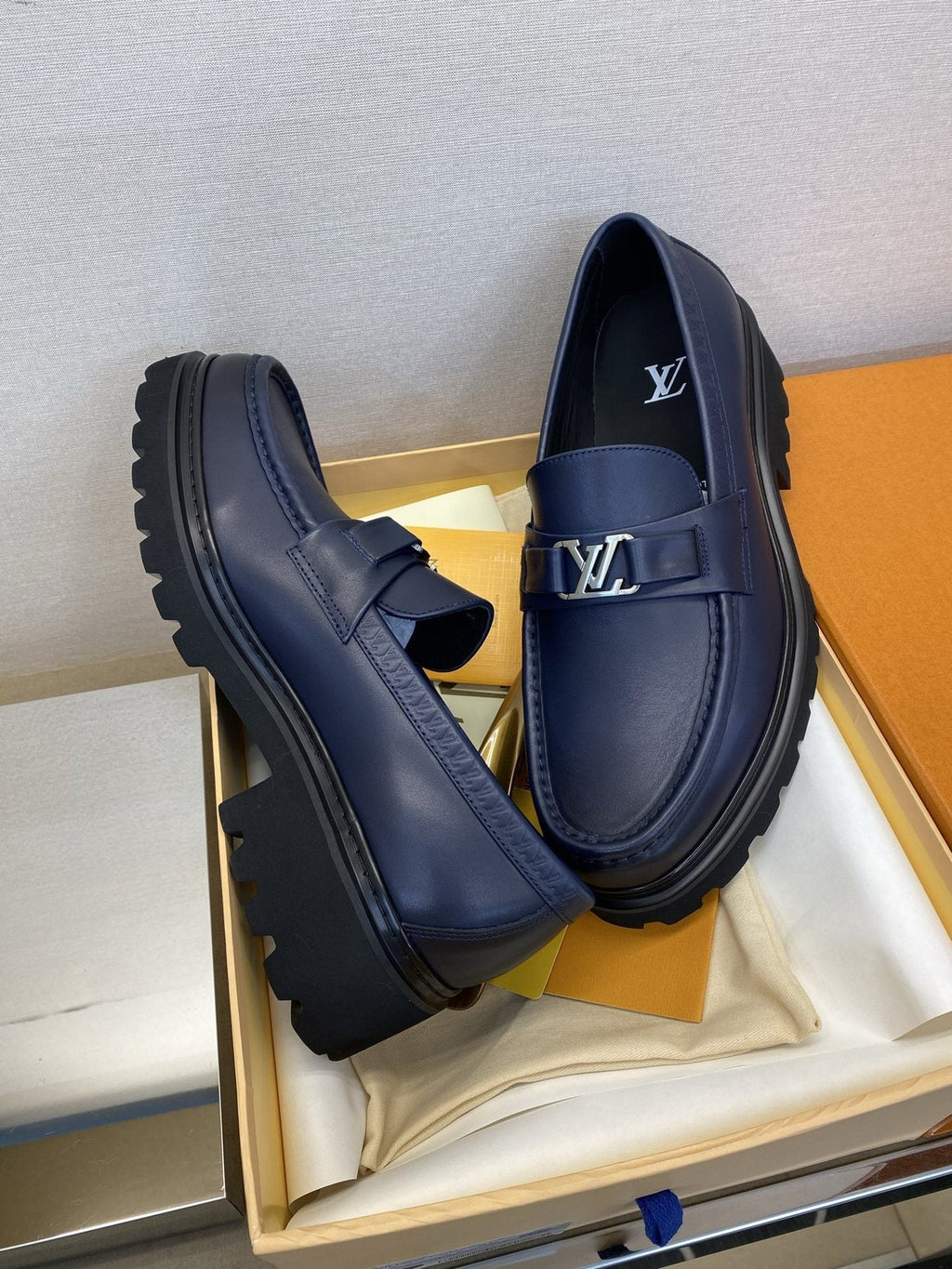 Louis Vuitton Men's Metal Logo Loafers